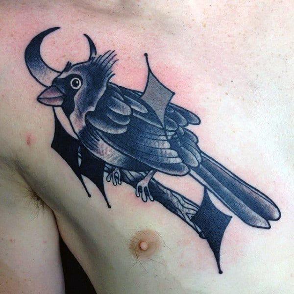 Black and white cardinal and crescent moon chest tattoo