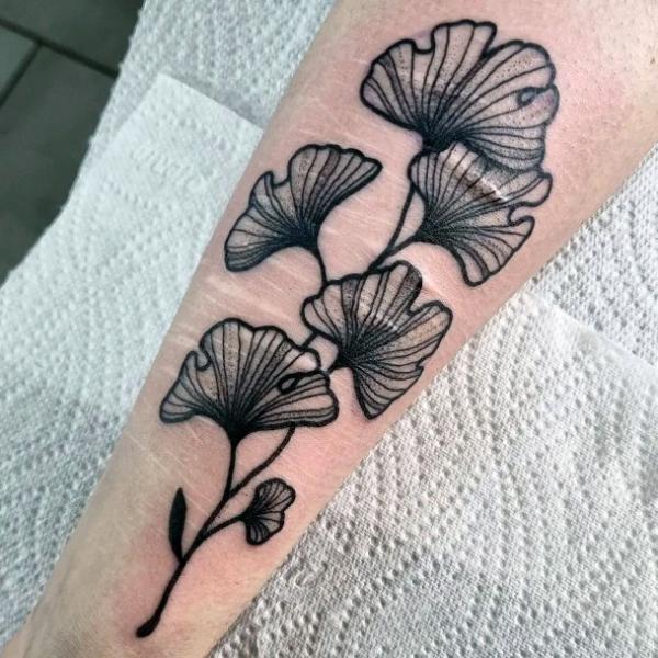 Black and white ginkgo forearm tattoo