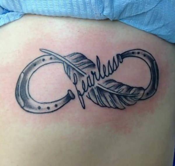 Black and white horseshoe infinity tattoo with word Fearless