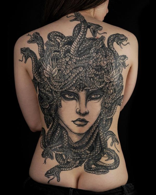 Black and white traditional Medusa full back tattoo