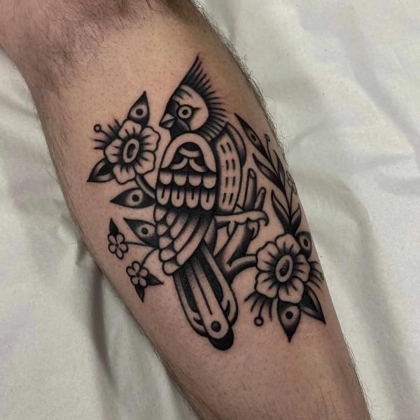 Black and white transitional cardinal calf tattoo