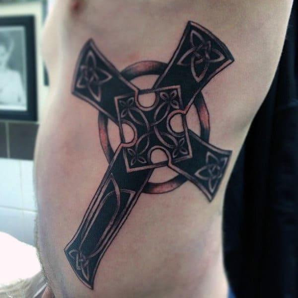 Blackwork Celtic cross side tattoo