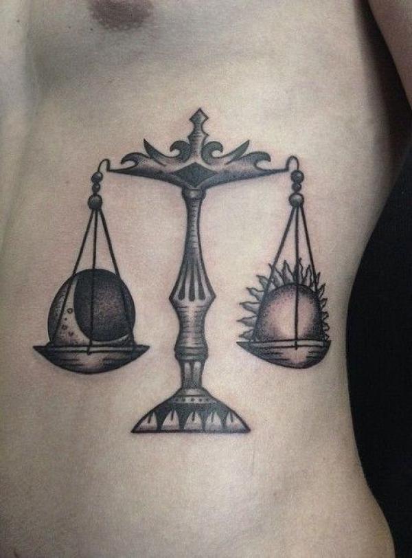 Blackwork Sun and moon Libra side tattoo