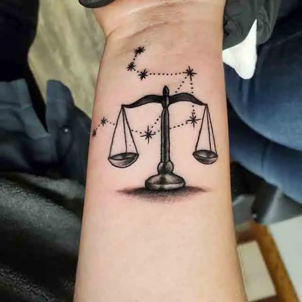 Blackwork libra constellation tattoo