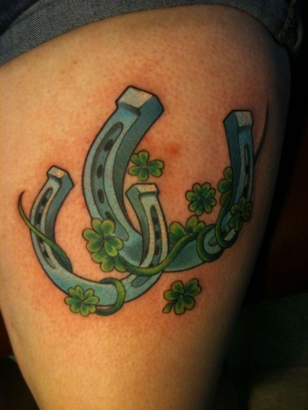 Blue horseshoe with shamrock tattoo