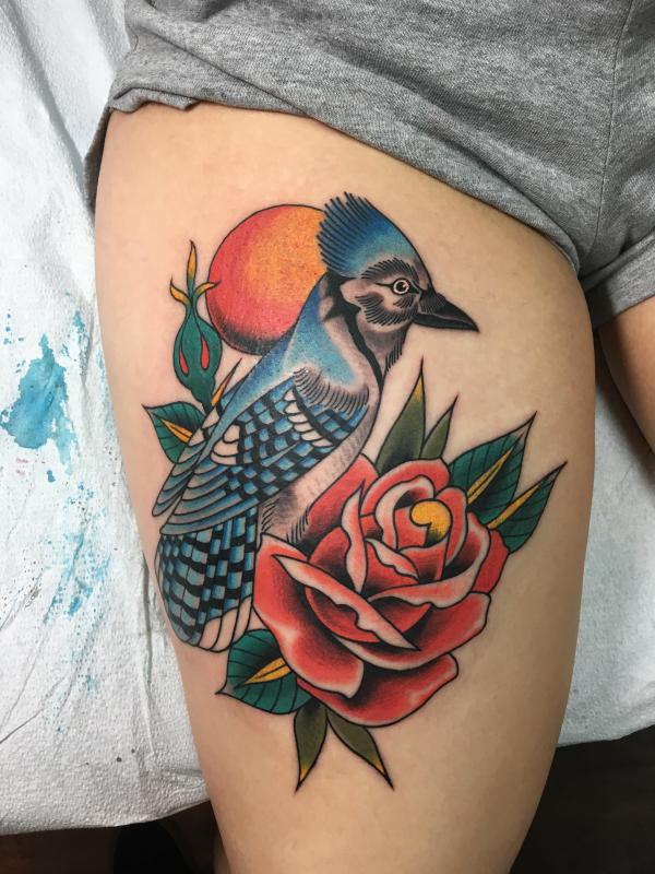 Blue jay and rose thigh tattoo