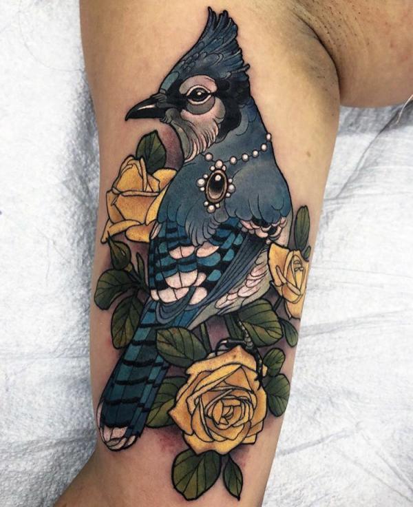 Blue jay with yellow rose tattoo