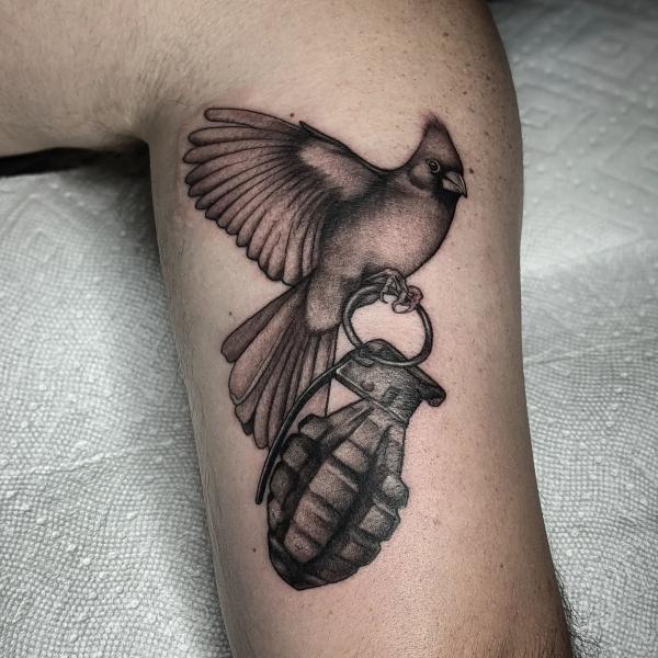 Cardinal and grenade tattoo black and white
