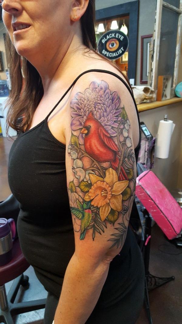 Cardinal and hummingbird in flowers sleeve tattoo