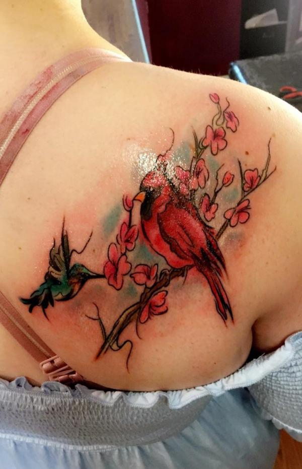 Cardinal and hummingbird with cheery blossom tattoo