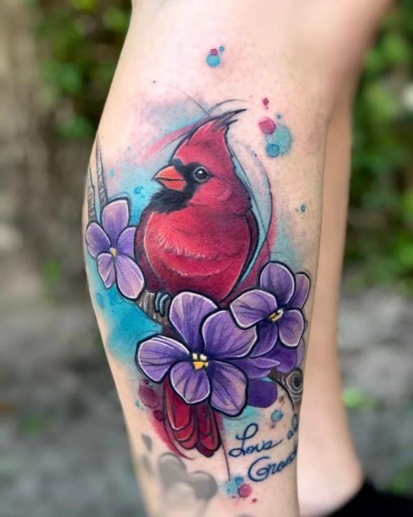 Cardinal and purple dogwood flower lower leg tattoo