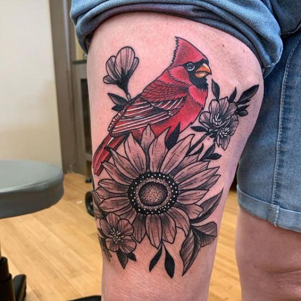 Cardinal and sunflower thigh tattoo