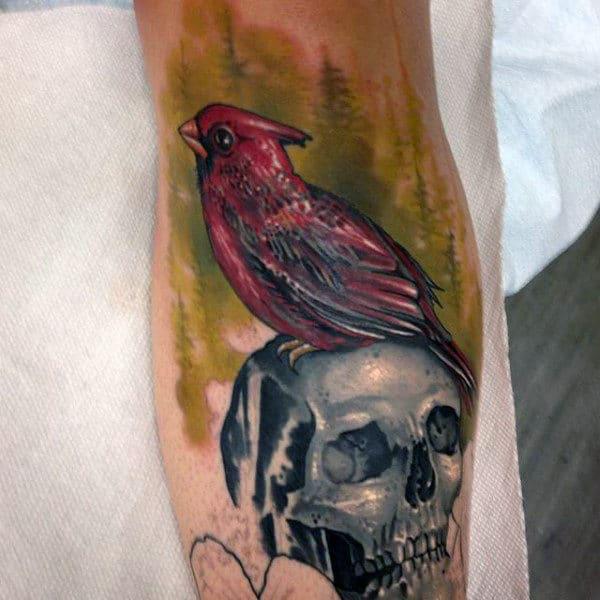 Cardinal on skull tattoo