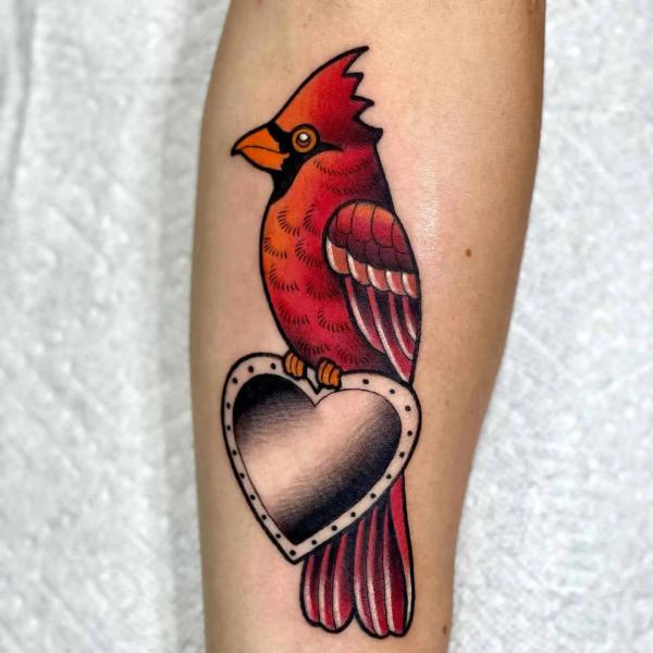 Cardinal perched on love symbol tattoo