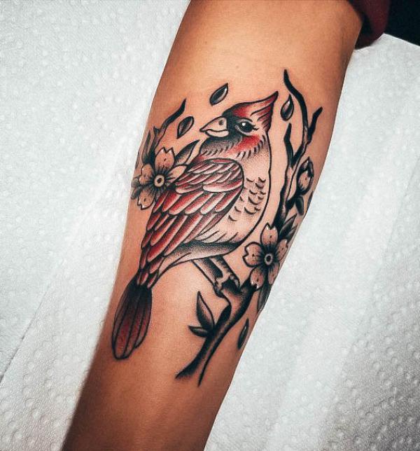 Cardinal with flower forearm tattoo