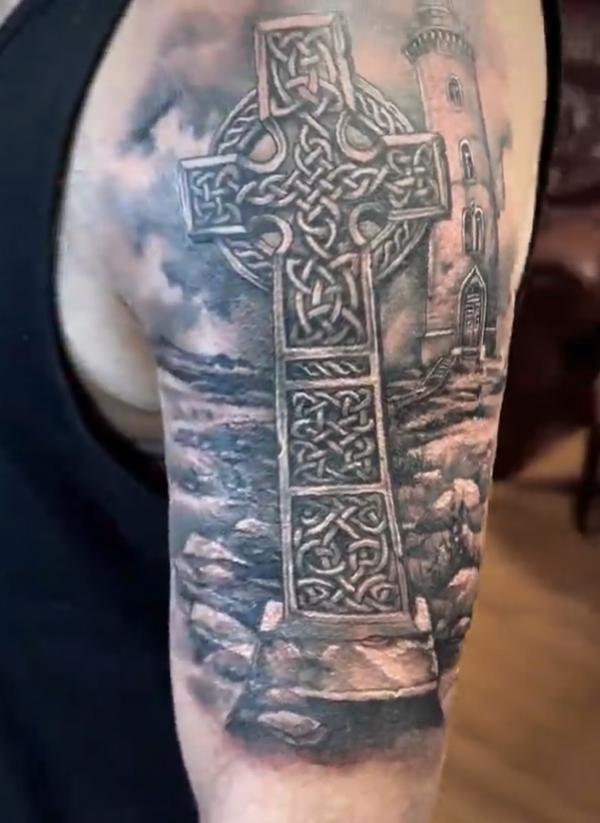 Celtic cross and lighthouse tattoo