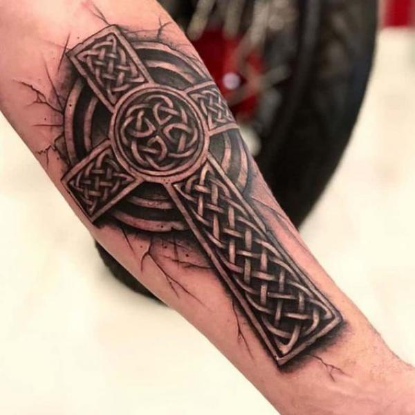Celtic cross arm tattoo