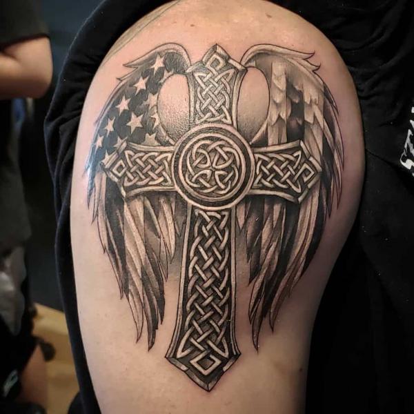 Celtic cross with Dara knot and American flag wing shoulder tattoo