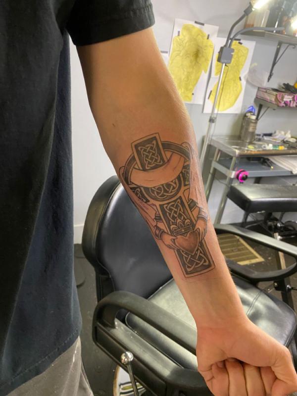 Celtic cross with claddagh inner forearm tattoo