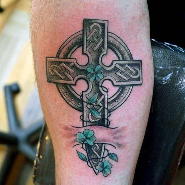 Celtic cross with clovers tattoo