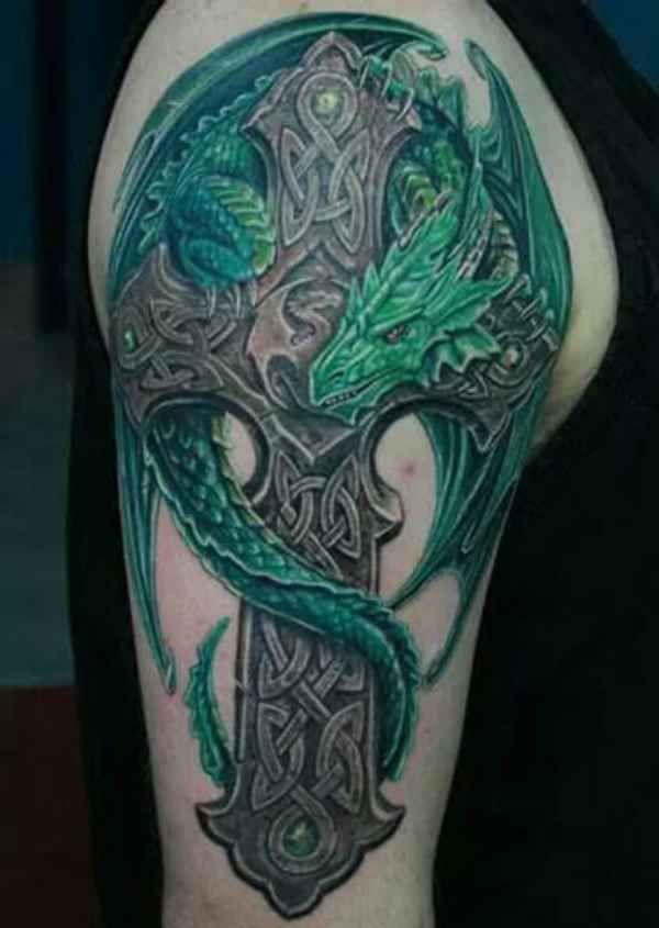 Celtic cross with green dragon tattoo