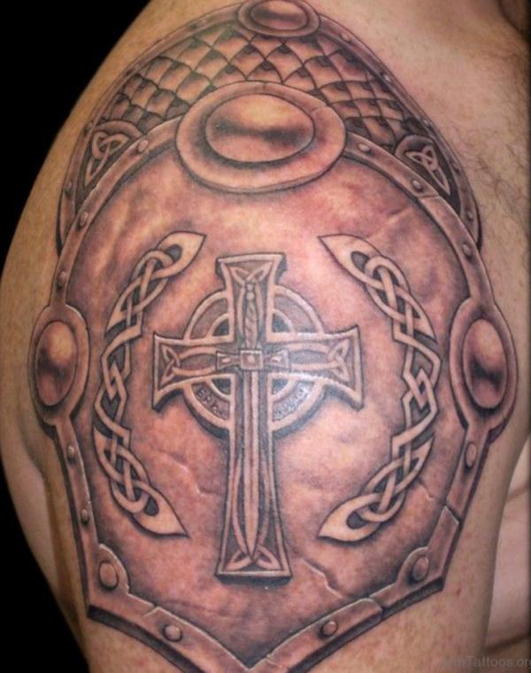 Celtic cross with sword shield shoulder tattoo