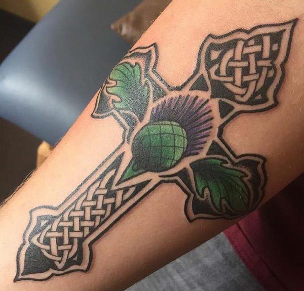 Celtic cross with thistle arm tattoo