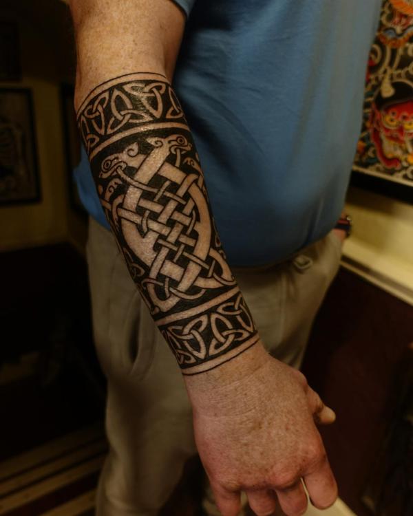 Celtic tribal half sleeve tattoo