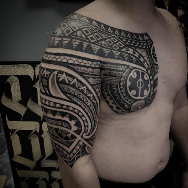 Chest panel to half sleeve tribal tattoo