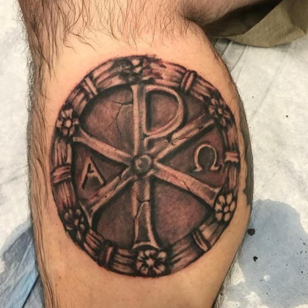 Chi Rho calf tattoo