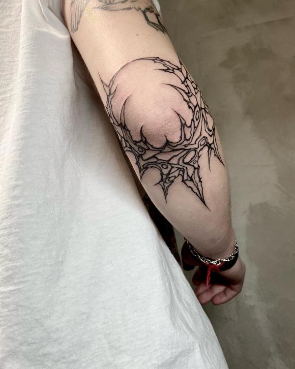 Circular thorns elbow outline tattoo
