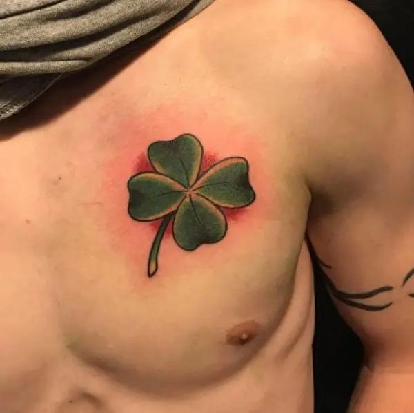 Clover chest tattoo