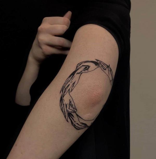 Connecting hands elbow tattoo