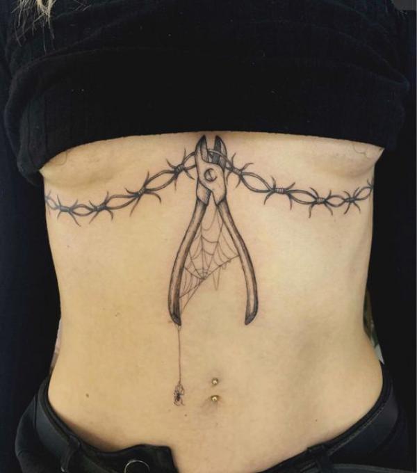 Cutting pliers with barbed wire sternum tattoo