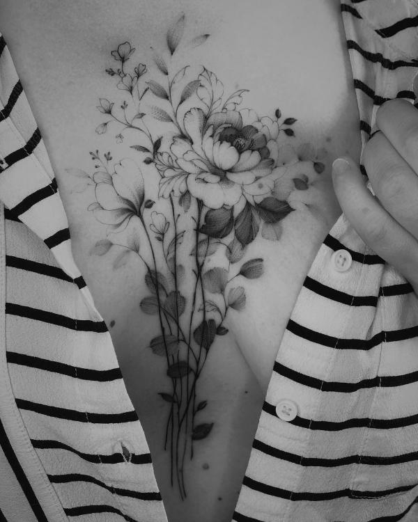 Dainty peony sternum tattoo black and grey