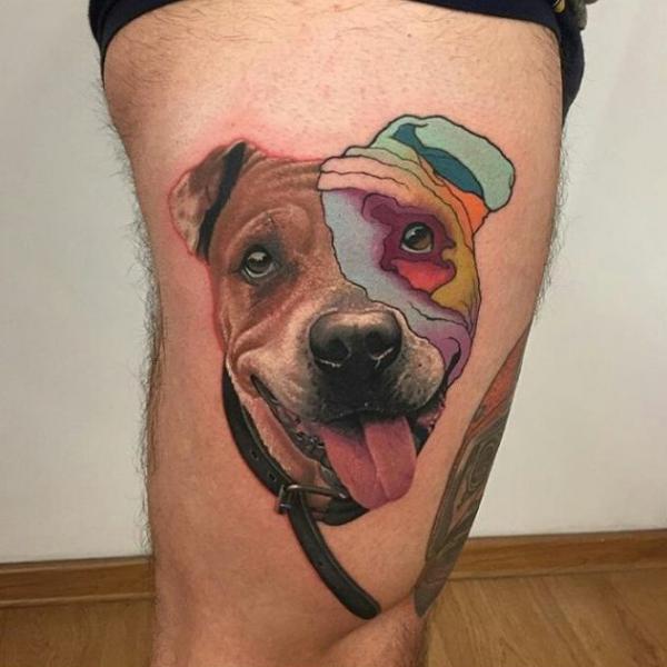 Dog tattoo above knee