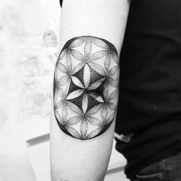 Dotwork flower of life elbow tattoo