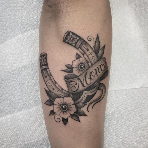 Dotwork horseshoe with flower tattoo for Mom