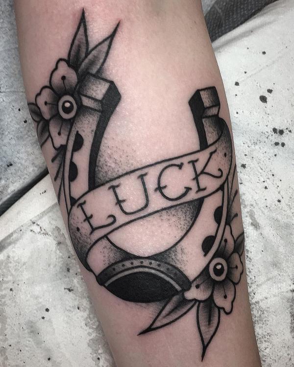 Dotwork lucky horseshoe tattoo