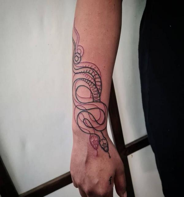 Double snake outline tattoo