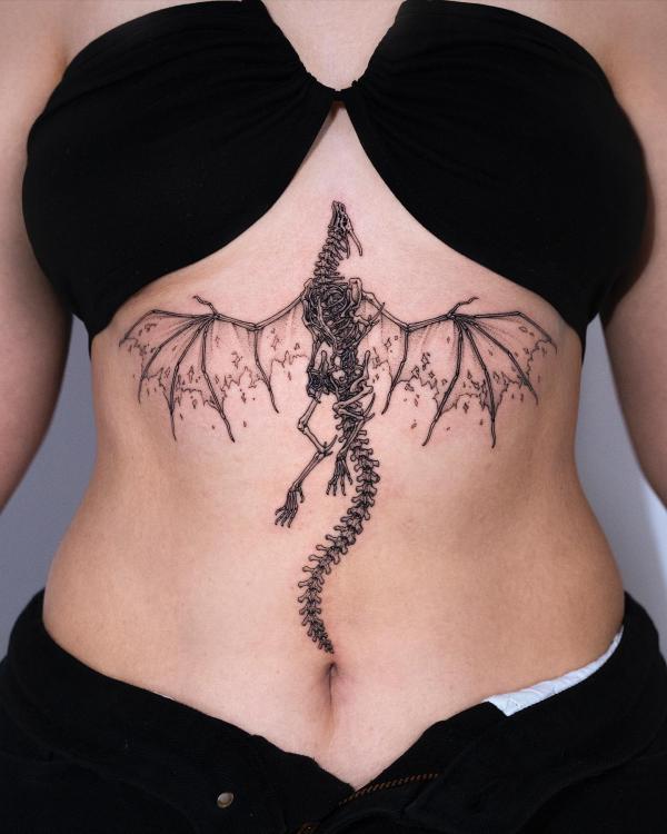 Dragon skeleton sternum tattoo
