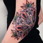 Elbow lotus flower tattoo traditional