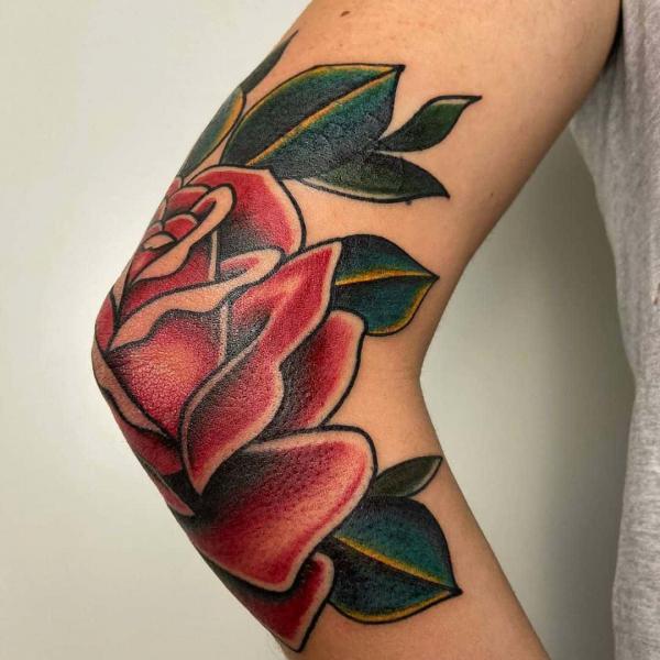 Elbow rose tattoo traditional
