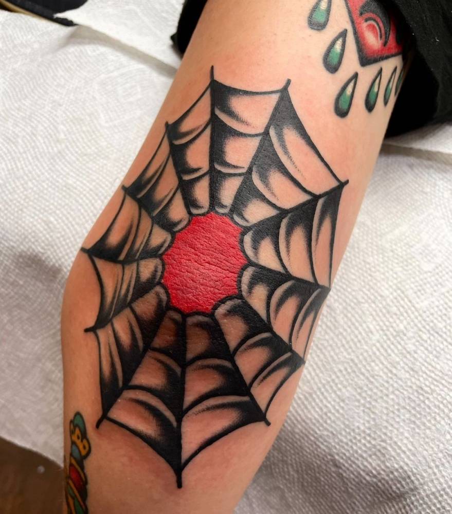 Elbow spiderweb tattoo old school