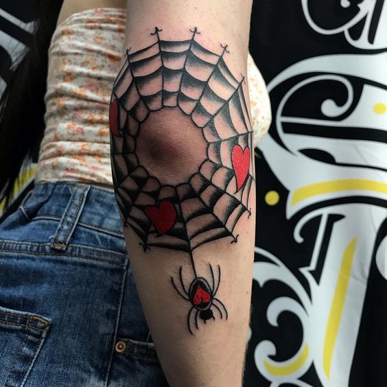Elbow spiderweb with hearts and spider tattoo traditional