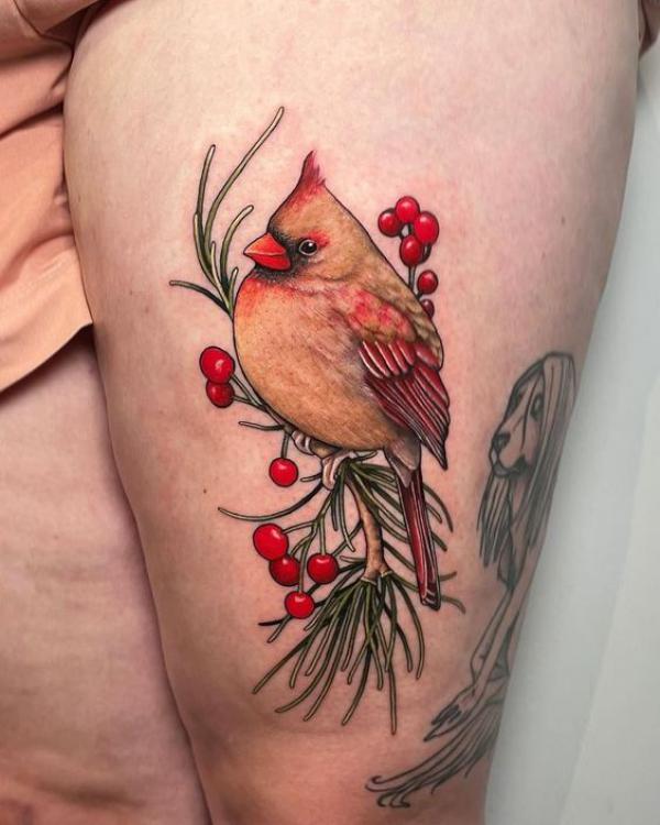 Female cardinal thigh tattoo