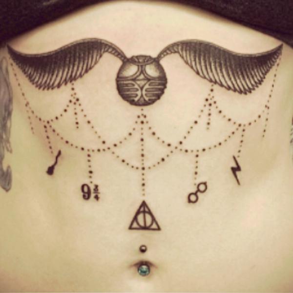 Feminine Harry Potter Golden snitch sternum tattoo