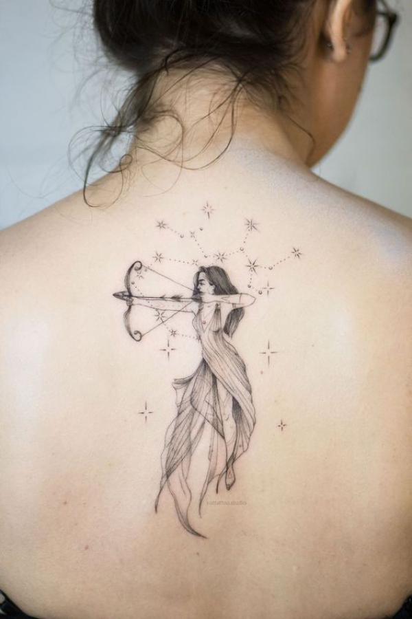 Feminine Sagittarius Archer with stars back tattoo