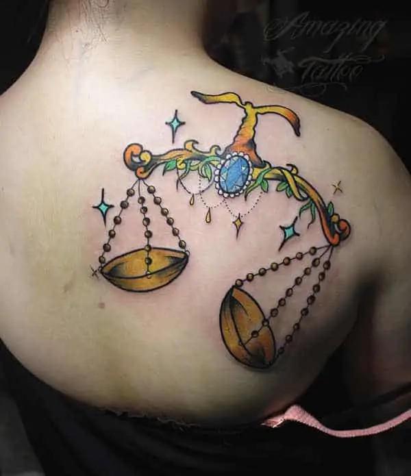 Feminine libra with pendant and stars tattoo