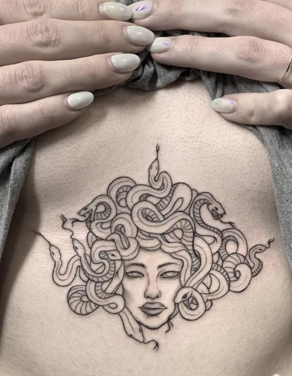 Feminine medusa sternum tattoo